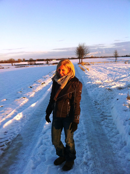 Hilary Robinson walking in a snowy landscape.